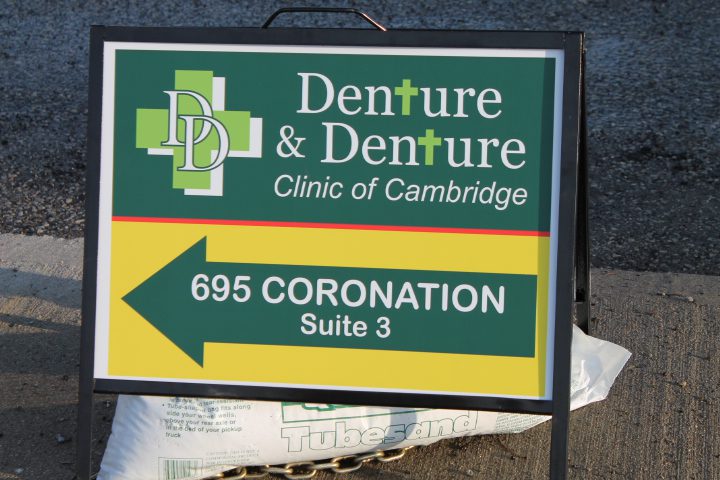A sign for denture and dentture clinic of cambridge.